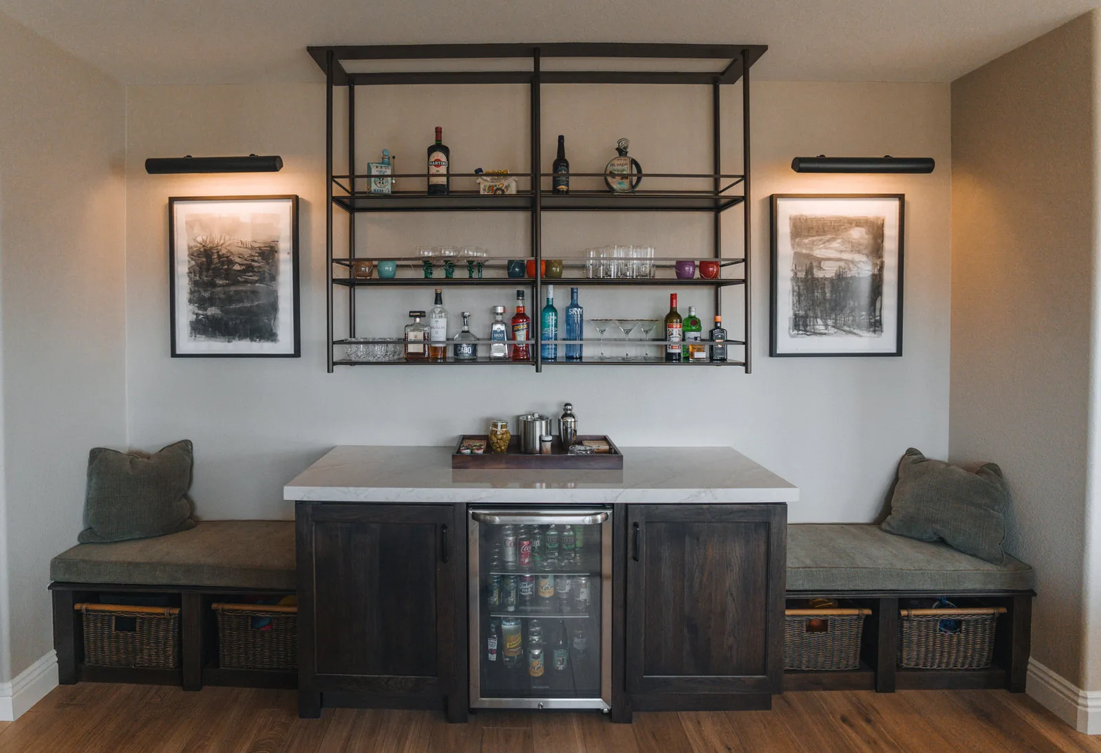 Built-in bar with bench seating, open shelving and a beverage fridge